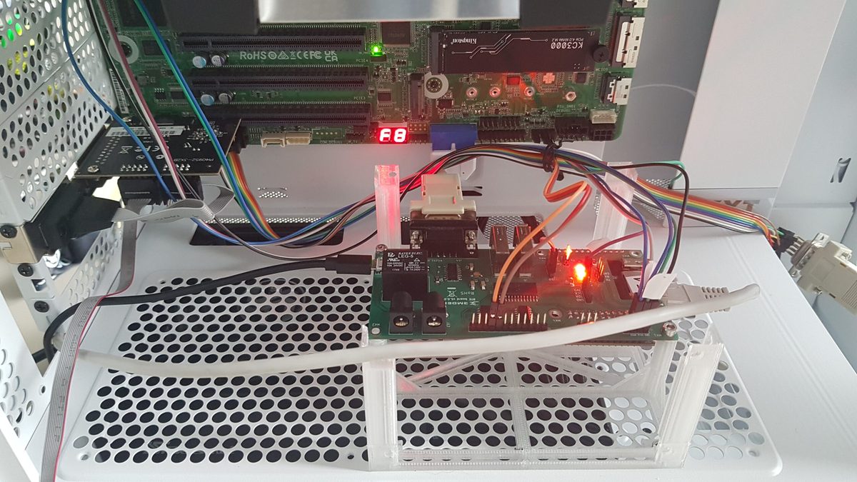 Close-up of the 3mdeb RTE board wired to the target's serial console and GPIO headers
